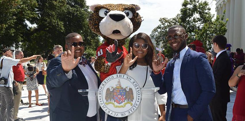 SGA members with Southpaw holding up J hand